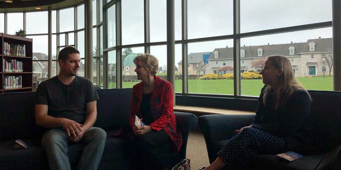 People speak inside Ridge Library at Mercyhurst North East